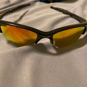 Black and orange Oakley glasses